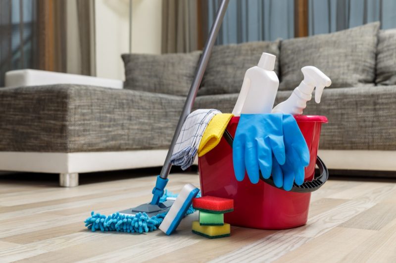 cleaning-service-sponges-chemicals-and-mop-picture-id654153664
